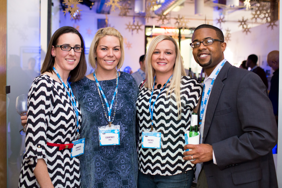 Four people pose for a photograph at a Dallas event